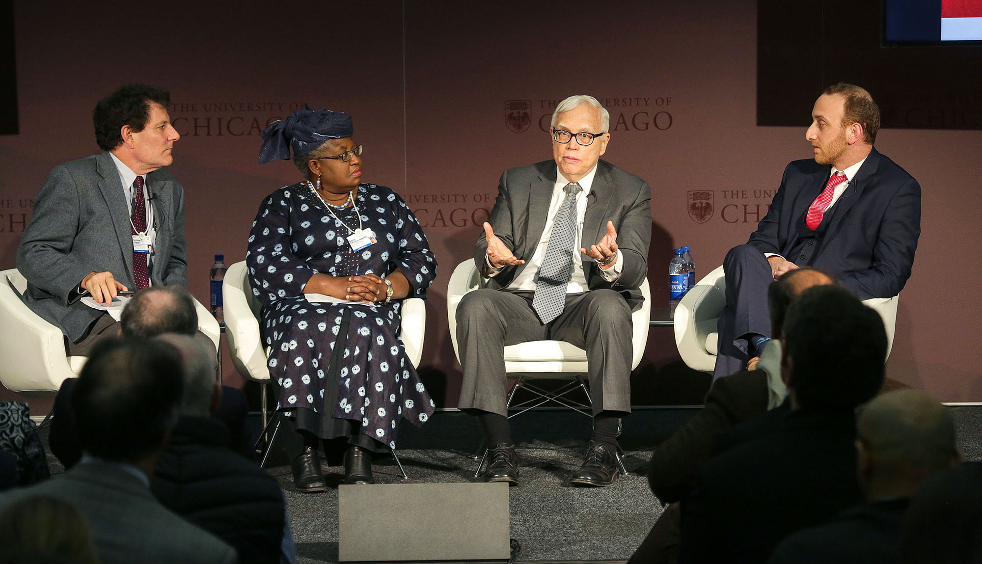 James Heckman sitting with Michael Feigelson, Nicholas Kristof, and Ngozi Okonjo-Iweala.